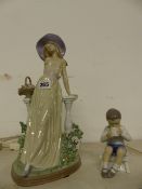 A LARGE LLADRO FIGURINE AND A SMALL COPENHAGEN FIGURINE.