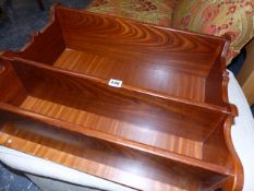 A HARDWOOD WALL SHELF.