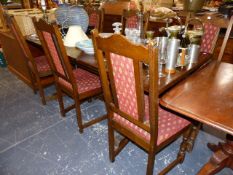 AN OAK EXTENDING TABLE AND SIX OLD CHARM DINING CHAIRS.