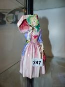 A ROYAL DOULTON MISS DEMURE FIGURINE.