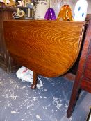 AN UNUSUAL OAK DROP LEAF DINING TABLE WITH PATENT MECHANISM.