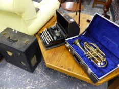 A TRUMPET, A TYPEWRITER AND A RECORD PLAYER.