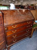 A GEORGIAN COUNTRY OAK BUREAU WITH FITTED INTERIOR.