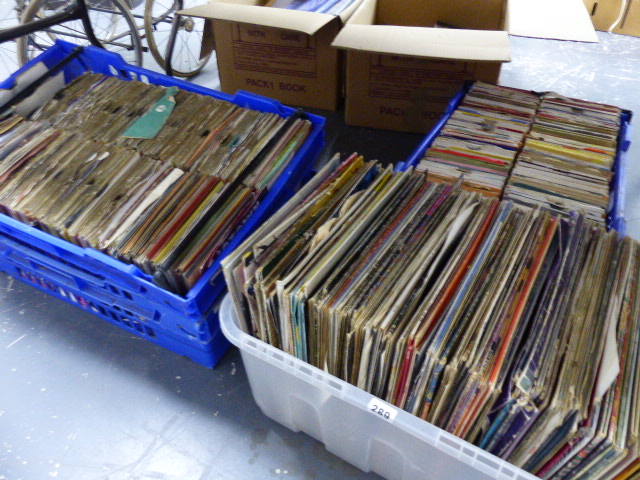 A LARGE QTY OF RECORD ALBUMS AND SINGLES.