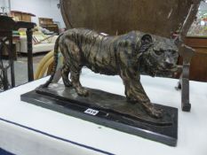 A BRONZE FIGURE OF A TIGER.