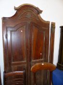 A WALNUT CABINET FRAME AND DOORS.