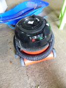 A BLACK AND DECKER STEAM CLEANER AND A HENRY VACUUM CLEANER.