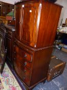 A MAHOGANY BOW FRONT MINIATURE TALLBOY.