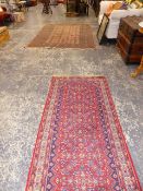 AN EASTERN PATTERN RUNNER AND ONE OTHER RUG.