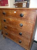 A VICTORIAN OAK CHEST OF FOUR LONG DRAWERS.