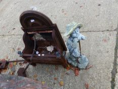 A CAST IRON FIRE BASKET AND A GARDEN FIGURE.