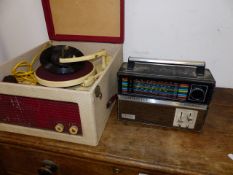 A VINTAGE RECORD PLAYER AND A RADIO.