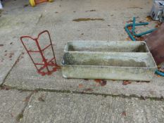 A PAIR OF RECTANGULAR PLANTERS AND A VINTAGE SADDLE RACK.