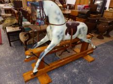 A GOOD QUALITY HADDON ROCKERS ROCKING HORSE ON PINE TRESTLE BASE.