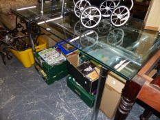 A GLASS TOPPED DINING TABLE.