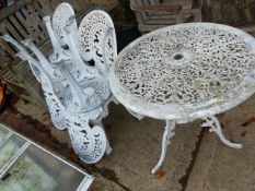 A PAINTED PATIO TABLE AND FOUR CHAIRS.