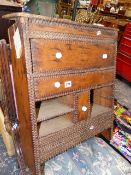 AN ANTIQUE TRAMP WORK WALL CABINET.