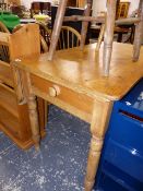 A VICTORIAN PINE KITCHEN TABLE.