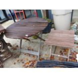 TWO FOLDING TEAK PATIO TABLES.