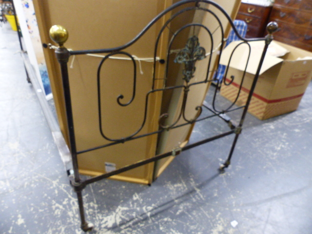 A WROUGHT IRON SINGLE BED.