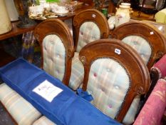 A SET OF FOUR VICTORIAN DINING CHAIRS WITH GOTHIC SHAPED BACKS.