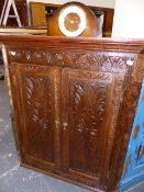 A 19th.C.CARVED OAK CORNER CABINET.