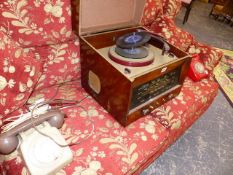 A RADIOGRAM AND TWO VINTAGE TELEPHONES.