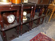 A SET OF FOUR BEDSIDE THREE TIER STANDS.