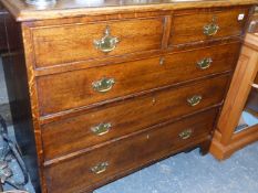 A GEORGIAN OAK CHEST OF DRAWERS.