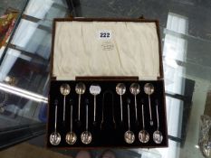 A SET OF TWELVE SILVER HALLMARKED COFFEE BEAN SPOONS AND A PAIR OF SUGAR NIPS.