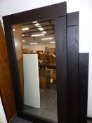 A SET OF THREE WALL MIRRORS.