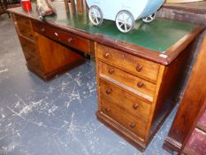 AN ANTIQUE MAHOGANY PEDESTAL DESK.