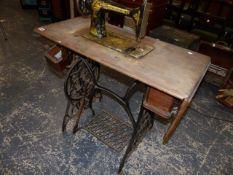 A TREADLE SEWING MACHINE.