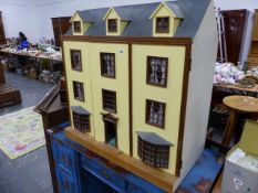 A LARGE GEORGIAN TOWN HOUSE DOLL'S HOUSE.