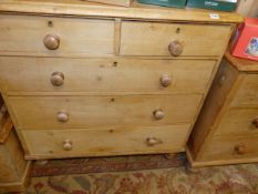 A VICTORIAN PINE CHEST OF TWO SHORT AND THREE LONG DRAWERS.