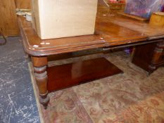 A VICTORIAN MAHOGANY EXTENDING DINING TABLE.