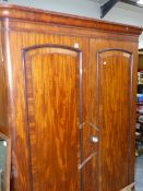 A VICTORIAN MAHOGANY WARDROBE.