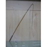 A NICKEL MOUNTED LEATHER HANDLED COACHING WHIP. W 150cms.