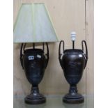 A PAIR OF BRONZE TWO HANDLED BALUSTER OIL LAMP BASES NOW FITTED FOR ELECTRICITY CAST WITH ANCIENT