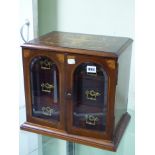 AN EDWARDIAN MARQUETRY MAHOGANY CIGAR CABINET, THE FRONT WITH BEVELLED GLASS ROUND ARCH GLAZED DOORS