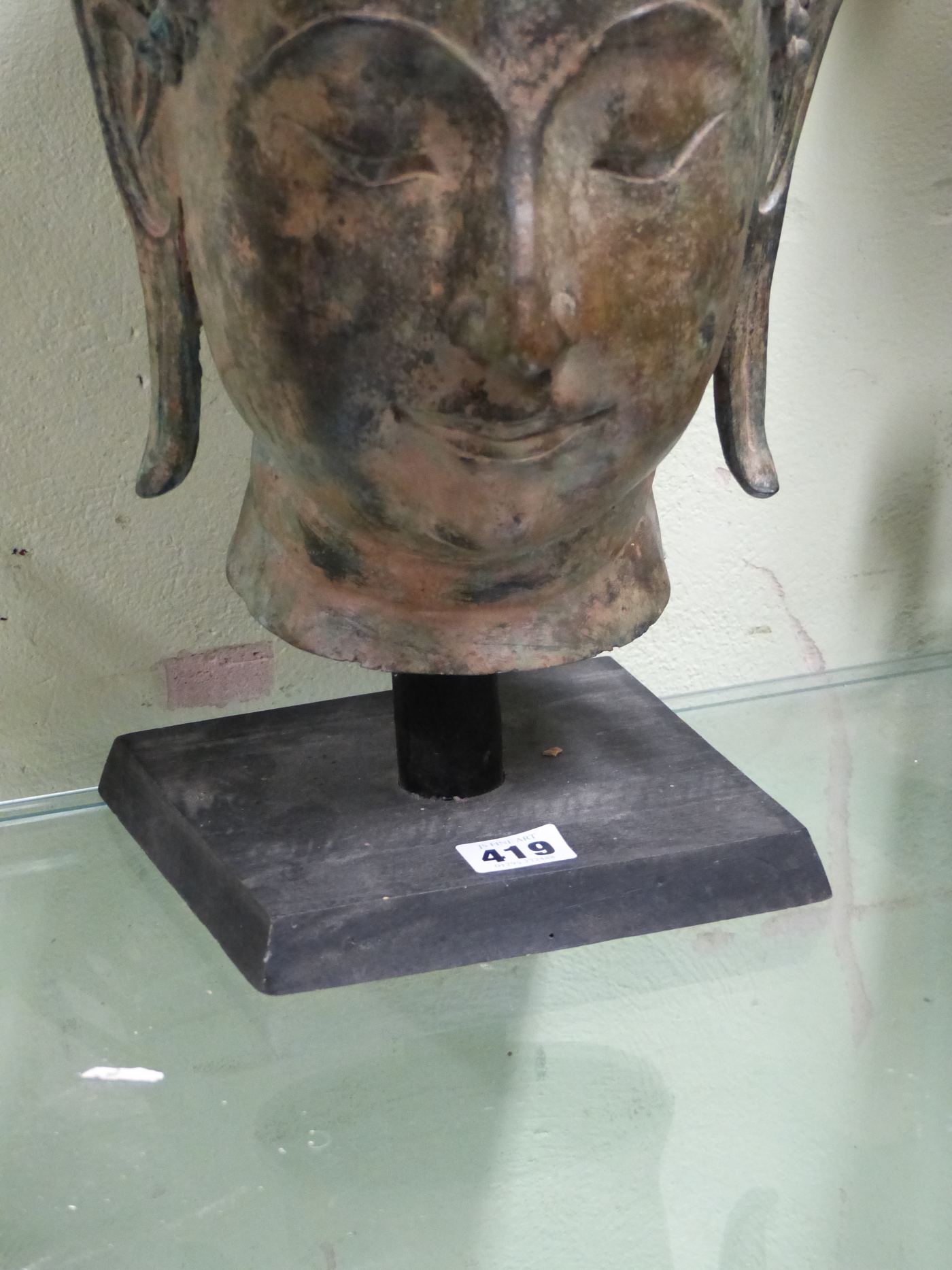 A THAI BRONZE HEAD OF THE BUDDHA, CURLED HAIR ABOVE HIS LONG LOBED EARS, HIS USNISA WITH FLAME - Image 4 of 10