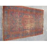 AN ANTIQUE PERSIAN HAMADAN RUG 205 x 138cms.