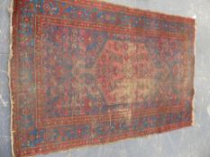 AN ANTIQUE PERSIAN HAMADAN RUG 205 x 138cms.