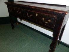 AN ANTIQUE PINE DRESSER WITH TWO APRON DRAWERS OVER CUT WORK SHAPED LEGS. W 139 x D 38.5 x H 76cms