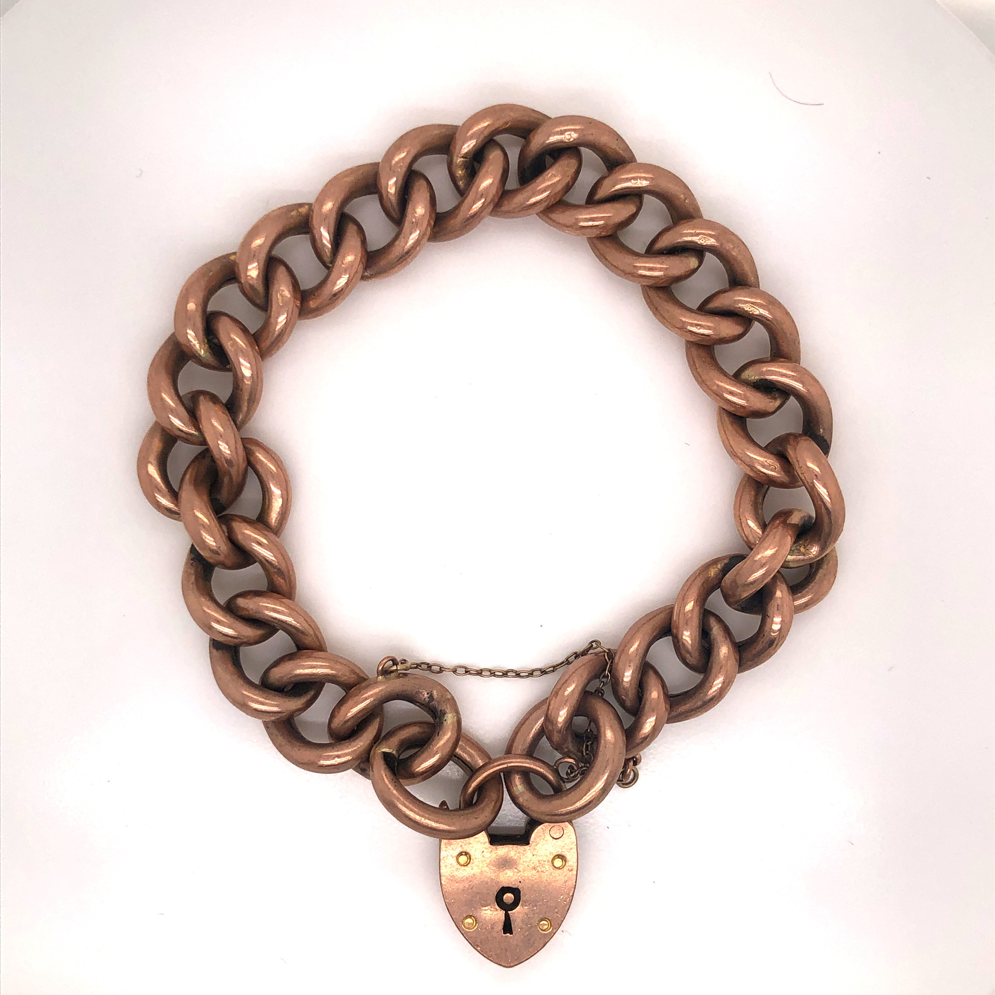 A 9ct OLD ROSE GOLD CURB LINK CHARM BRACELET EACH LINKED STAMPED 9ct, COMPLETE WITH PADLOCK AND - Image 2 of 2