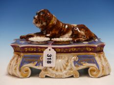 ATTRIBUTED TO JACOB PETTIT, AN INKSTAND WITH REMOVABLE SPRINKLER AND INKWELL, A BULL MASTIFF