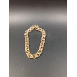 A 14CT GOLD DOUBLE INTERWOVEN SOLID CURB BRACELET, LENGTH 22cms, WEIGHT 47grms.