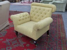 A BESPOKE GEORGE SMITH BUTTON UPHOLSTERED BUTTERFLY CHAIR IN PALE YELLOW FABRIC ON TURNED LEGS