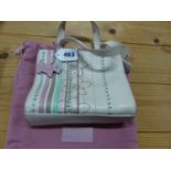 A RADLEY CREAM LEATHER HANDBAG SEWN WITH FLOWER HEADS AND TURQUOISE, PINK AND BROWN LEATHER BANDS