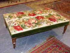 A LARGE BESPOKE VICTORIAN STYLE STOOL WITH NEEDLE POINT AND VELVET UPHOLSTERY ON TURNED LEGS AND